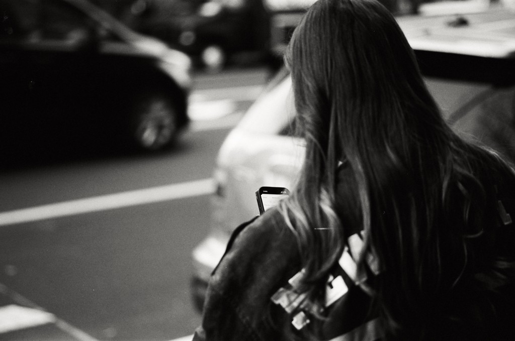 Person alone surrounded by social media notifications